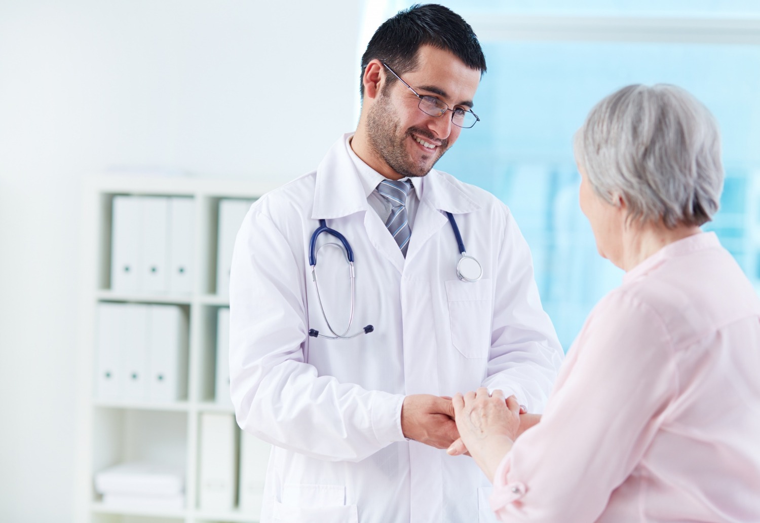 A doctor talking with an older patient